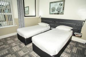 Säng eller sängar i ett rum på Jewells Guest Accommodation