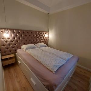 Posteľ alebo postele v izbe v ubytovaní Ancsi Apartmant Kecskemét