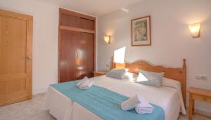 Cama o camas de una habitación en Apartamentos Moon Dreams Los Lentiscos