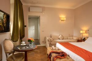 Postel nebo postele na pokoji v ubytování Vivaldi Luxury Rooms