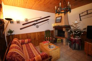 a living room with a couch and a fireplace at Toupinat in Montferrier