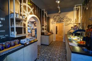 a kitchen with a counter in a restaurant at Hotel Stadt Cuxhaven in Cuxhaven