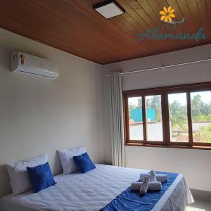 Postel nebo postele na pokoji v ubytování Flat Alamanda + 16 fotografií
