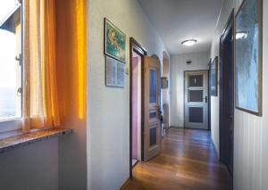 a hallway of a room with orange curtains and a door at Guest House Nena in Motovun