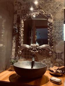 a sink in a bathroom with a large mirror at Luxury Lake House & Glamping in Teşila +52 photos