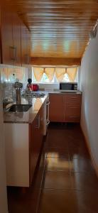 a kitchen with a sink and a counter top at LU-MAR in Caviahue