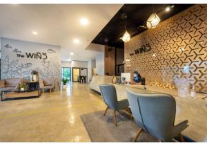 TV a/nebo společenská místnost v ubytování The Wind Hotel