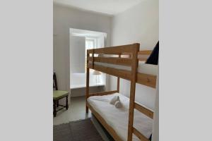 a bedroom with two bunk beds in a room at Central Ericeira 4 Bedrooms by Lovely Bay - Fte Cabo in Ericeira