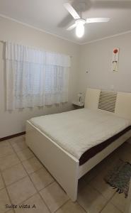 Tempat tidur dalam kamar di Apartamento Amplo Praia Grande Ubatuba JJ Mendes