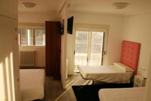 Ein Bett oder Betten in einem Zimmer der Unterkunft Mirador del Ermitage