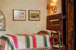 Łóżko lub łóżka w pokoju w obiekcie Posada de las Minas