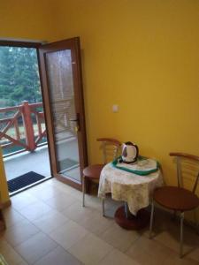 a room with a table with a tea kettle on it at Bacówka Noclegi in Sierpnica