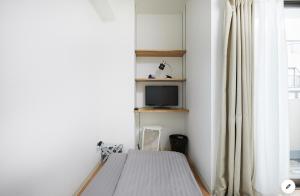 En eller flere senge i et værelse på Marvelous Kinshicho - Vacation STAY 12904v