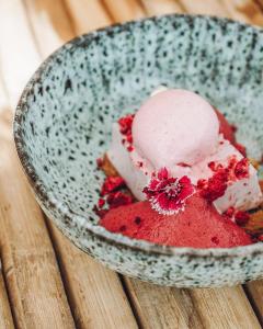 a bowl filled with red and white ice cream at Nomad Hotel - Xábia Port in Jávea