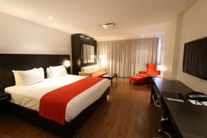 Ένα ή περισσότερα κρεβάτια σε δωμάτιο στο Hotel Classique
