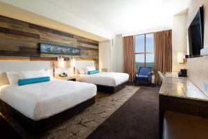 A bed or beds in a room at Chukchansi Gold Resort & Casino