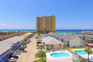 a view of a resort with a pool and the ocean at Wendwood D4 in Panama City Beach