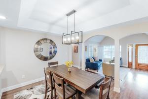 a dining room and living room with a table and chairs at Urban Villita in San Antonio