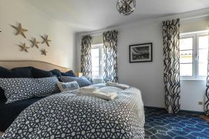 מיטה או מיטות בחדר ב-Casa Vista Marina