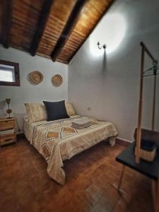 Ένα ή περισσότερα κρεβάτια σε δωμάτιο στο Casas Blancas - Suite 1