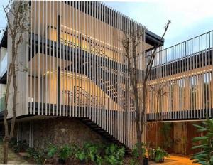 a building with a staircase on the side of it at Pousada Maria Flor in Fernando de Noronha