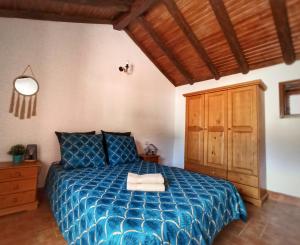 Ένα ή περισσότερα κρεβάτια σε δωμάτιο στο Casas Blancas - Suite 1