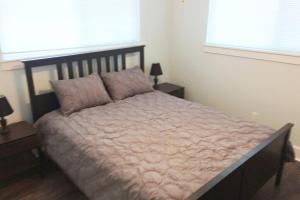 A bed or beds in a room at Beach Front on West Beach