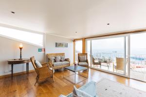 a living room with a couch and a table at Casablu Hotel in Valparaíso