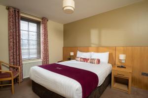 A bed or beds in a room at Lodge at Lough Erne