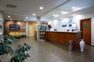 a lobby of a hospital with a reception counter at Hotel Concorde in Camerano