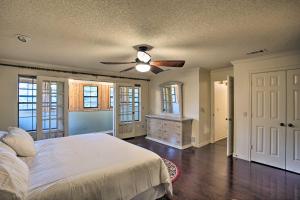 a bedroom with a bed and a ceiling fan at Family-Friendly Home with Pool Table, Patio, and Grill in McKinney