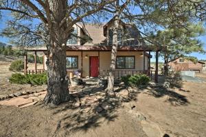 a house with a tree in front of it at Spacious Family Home Surrounded by Mtn Views! in Flagstaff