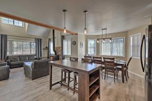 a living room with a table and a dining room at Spacious Family Home Surrounded by Mtn Views! in Flagstaff