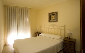 Cama o camas de una habitación en Apartamentos Casa Ameiros