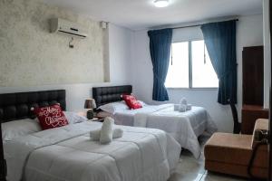 Ліжко або ліжка в номері Hotel Valeritos