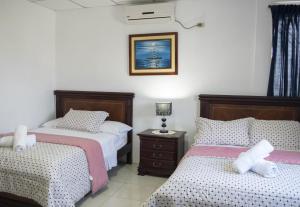 Ліжко або ліжка в номері Hotel Valeritos