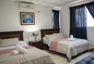 Ліжко або ліжка в номері Hotel Valeritos