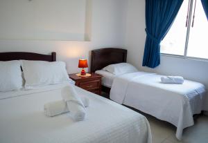 Ліжко або ліжка в номері Hotel Valeritos