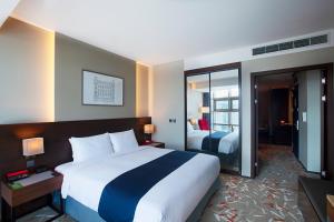 Postel nebo postele na pokoji v ubytování ASTI Hotel Busan Station
