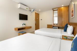 Posteľ alebo postele v izbe v ubytovaní CODI SEA Hotel & Travel