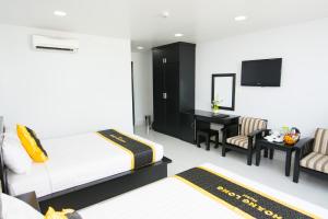 Postel nebo postele na pokoji v ubytování Hoang Long Hotel Phan Thiết