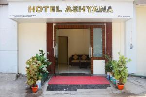 an entrance to a hotel asiyaarma with a red carpet in front at Hotel Ashyana-Grant Road Mumbai in Mumbai