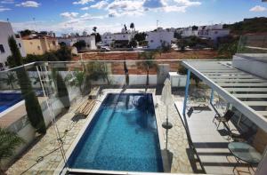 a swimming pool on the balcony of a apartment at Milos Lifestyle Villa 17 in Protaras