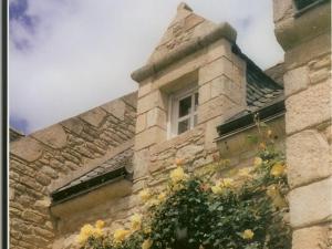 a building with a window on the side of it at Chambres d'hotes "Manoir Des Quatre Saisons" in La Turballe