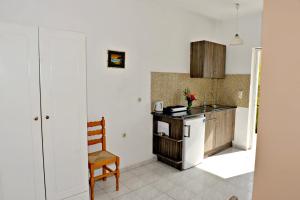 Kuchyň nebo kuchyňský kout v ubytování Pothos Hotel Alykes