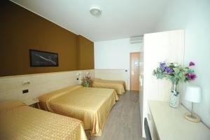 Postel nebo postele na pokoji v ubytování Hotel Mare