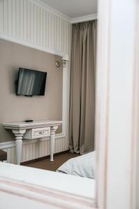 TV a/nebo společenská místnost v ubytování Orly Park-Hotel