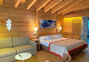 Voodi või voodid majutusasutuse Nendaz 4 Vallées & SPA 4* Superior toas