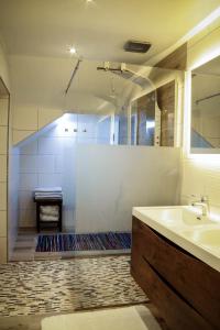 a bathroom with a shower and a sink and a tub at Apartment Erlauf - Ursprung, - 6 Personen, Outdoorsauna mit Bachzugang in Mitterbach