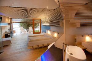 Postel nebo postele na pokoji v ubytování Ambienthotel PrimaLuna